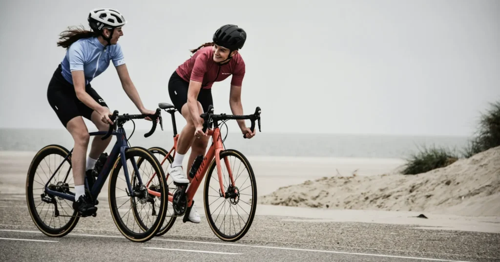 Two girls cycling as an exercise in the morning.