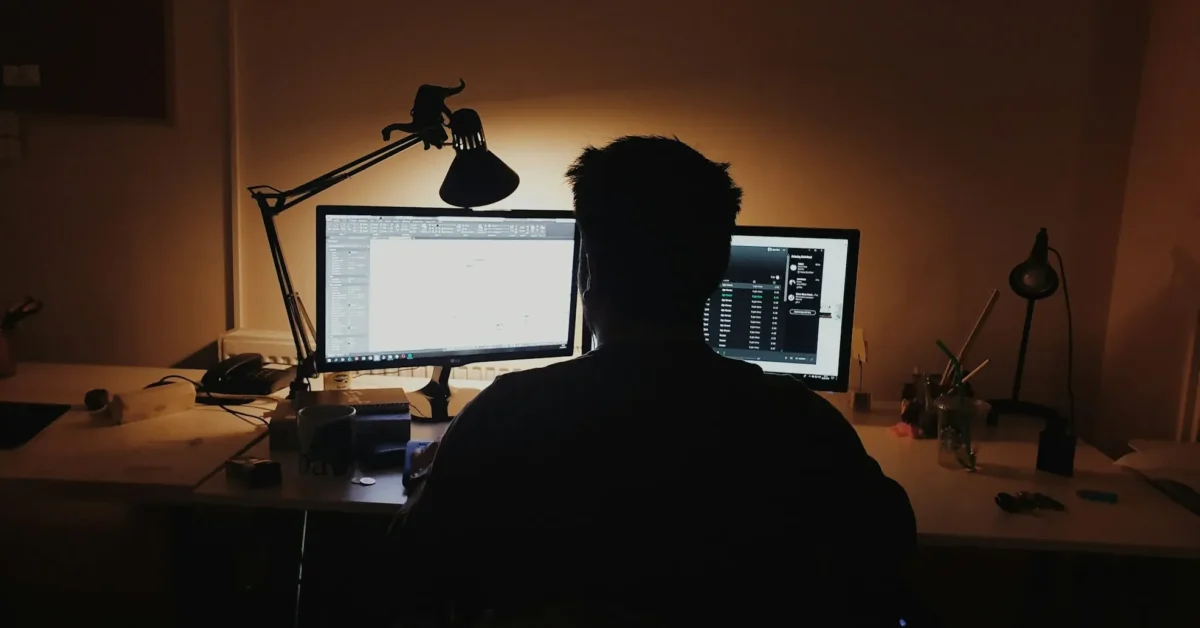 A person watching the screens.