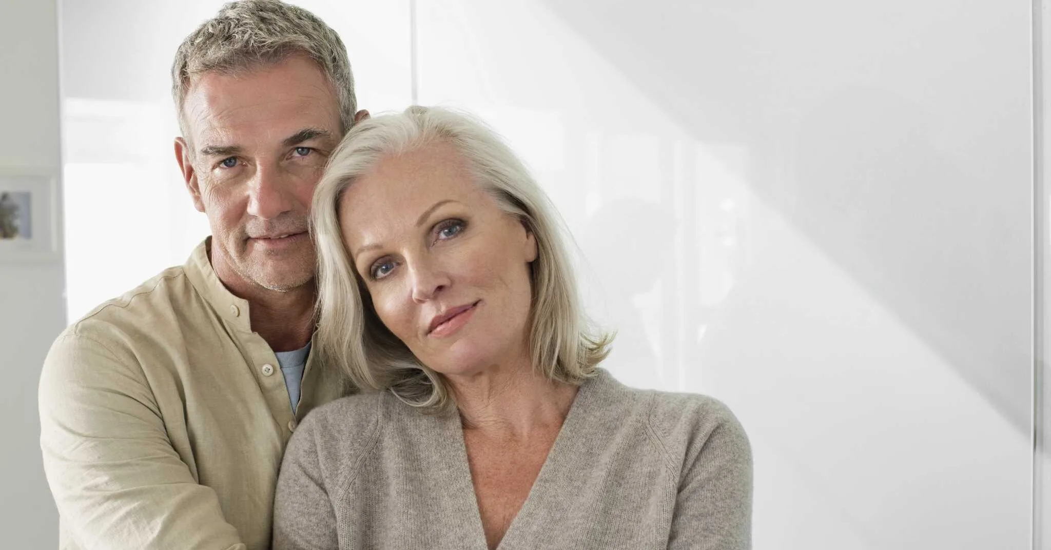 A man and woman embrace in a white room, symbolizing love and commitment after 25 years of marriage. What am I entitled to?
