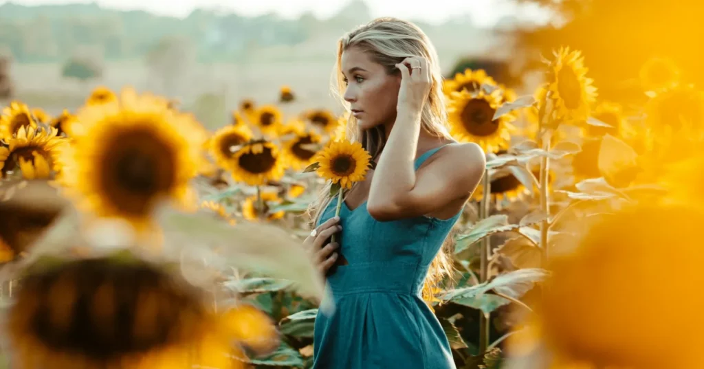 An alone girl with a flower.