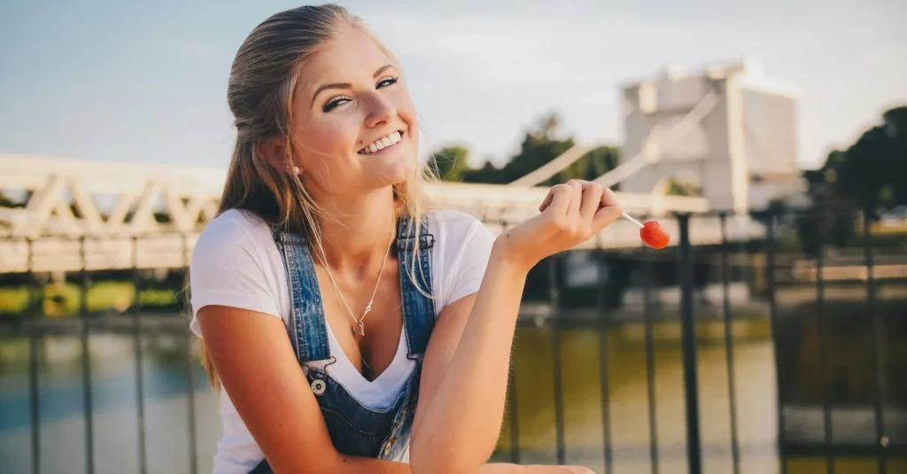 A smiling girl having a cleft chin.