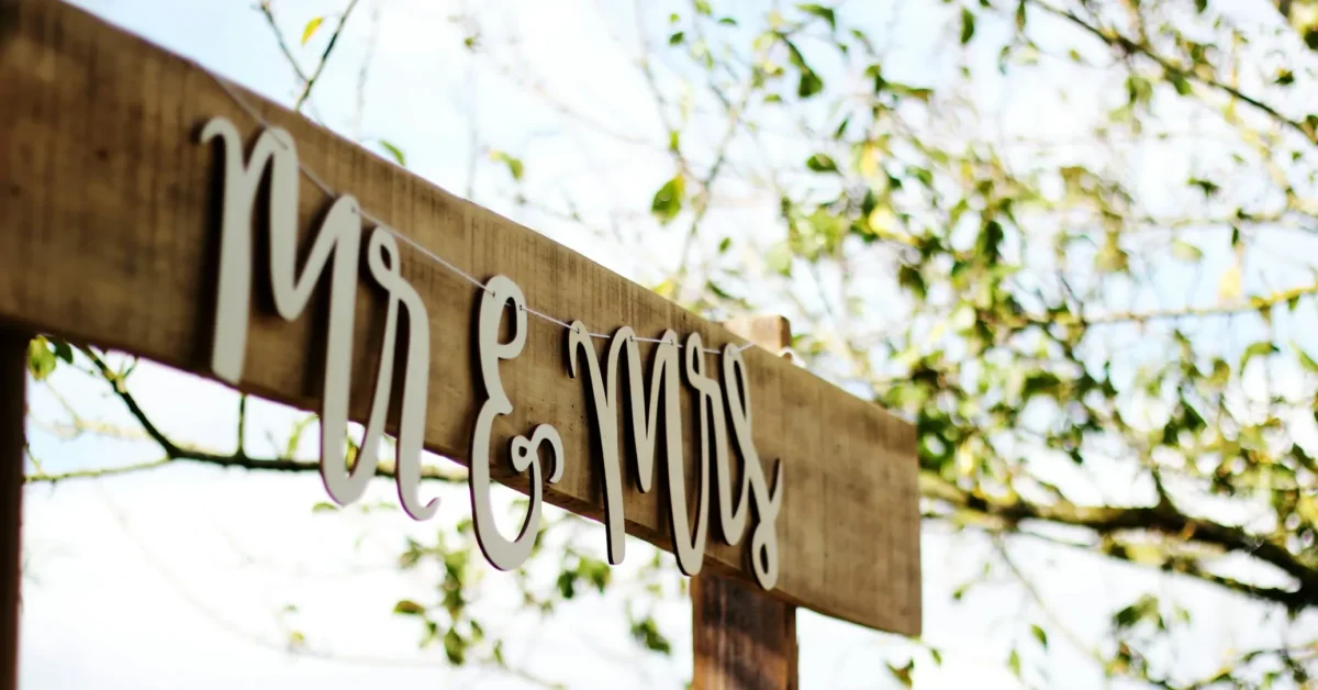 Mr. and Mrs. crafted wooden banner.