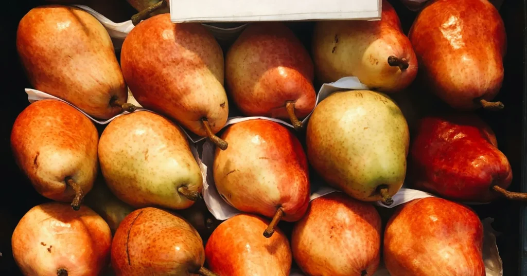 Reddish pears stack on one another.