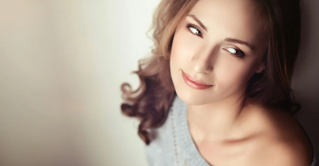 A girl smiling to prevent Loose Skin to look beautiful.