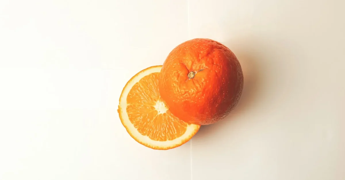 An orange cut into half to represent its hydrated property.
