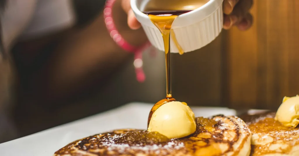 Fat free bosco syrup pouring on breakfast.
