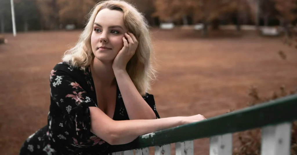 A BEAUTIFUL LADY WEARING FLORAL DRESS.